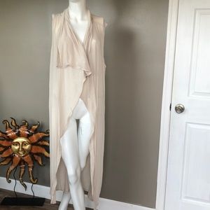 Cream colored sleeveless duster lightweight flowy